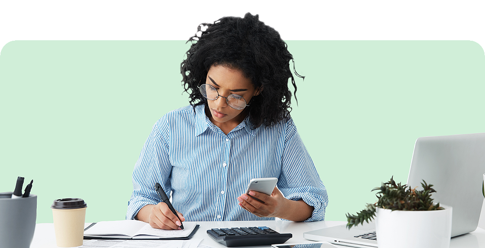 Small business owner bookkeeping on mobile phone