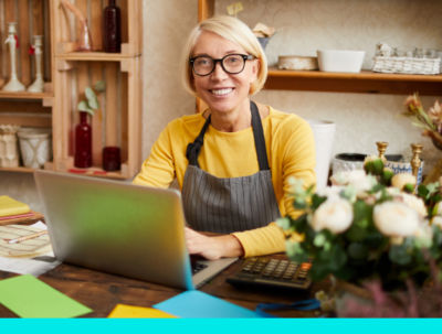 florist working at laptop forming her business with Block Advisors