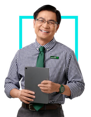 A Block Advisors small business tax professional smiling standing with a tablet in hand