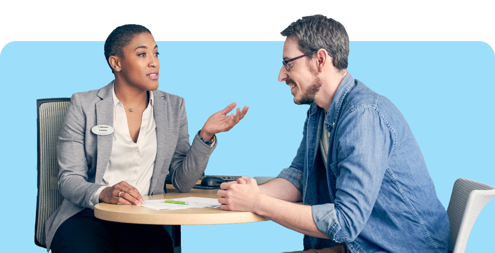 Woman and man discussing payroll for multiple employees