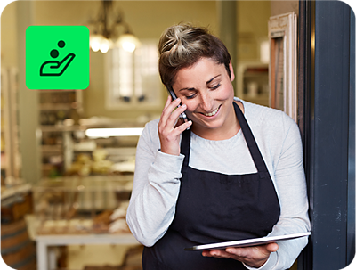 small business owner reviewing tax return using H&R Block Free Online tax filing on a tablet