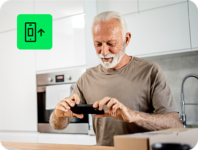 individual entering tax information on a smartphone using H&R Block Free Online tax filing service at home