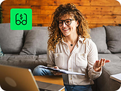person using H&R Block Premium Online Tax Filing with unlimited expert tax help feature on laptop