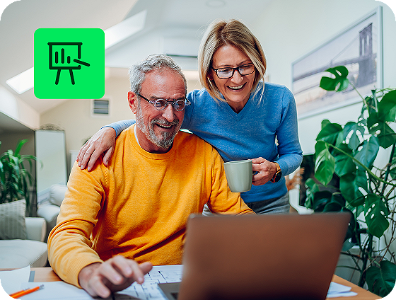 two people reviewing investment income reports with H&R Block Premium Online Tax Filing