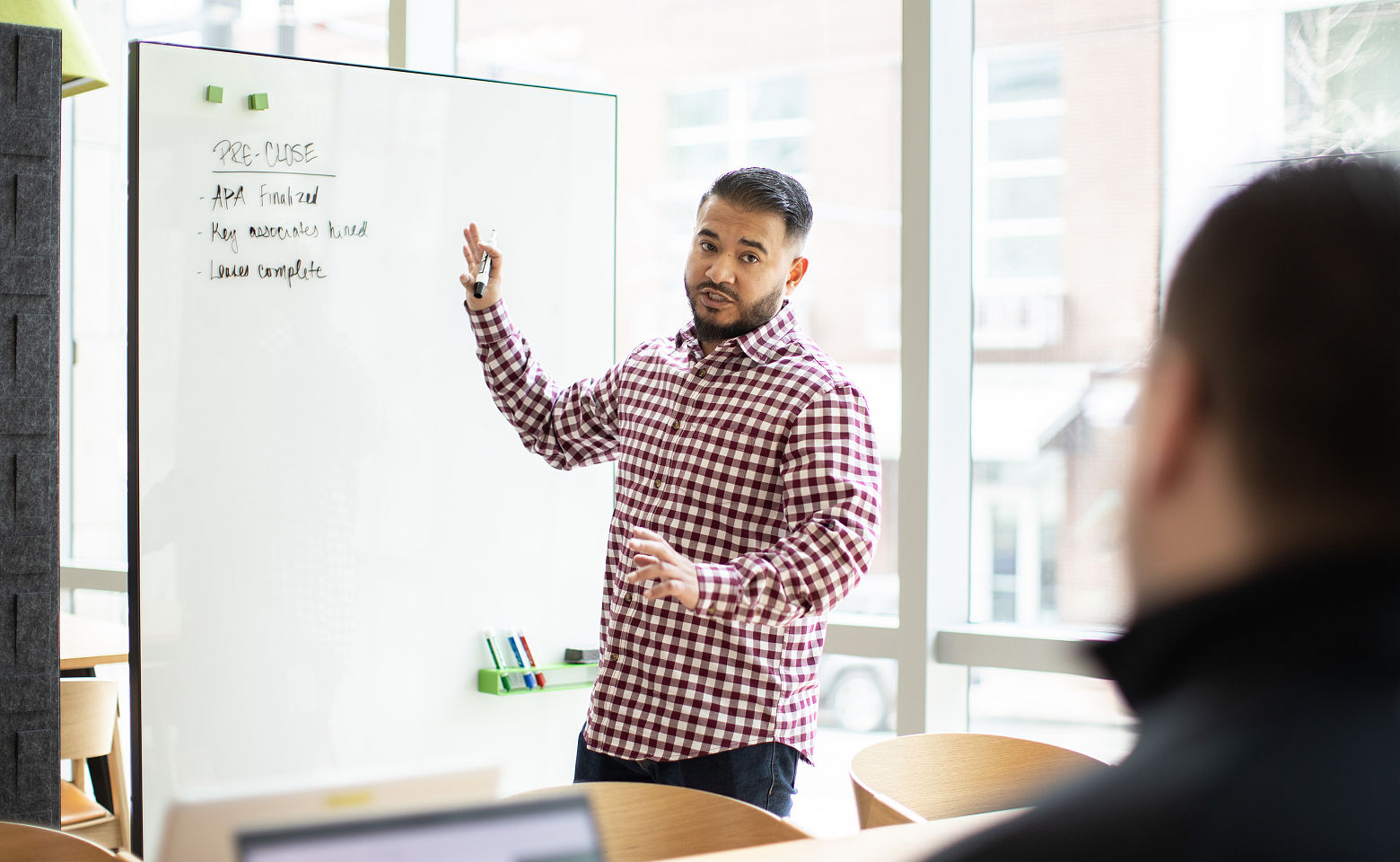 man teaching income tax course to class