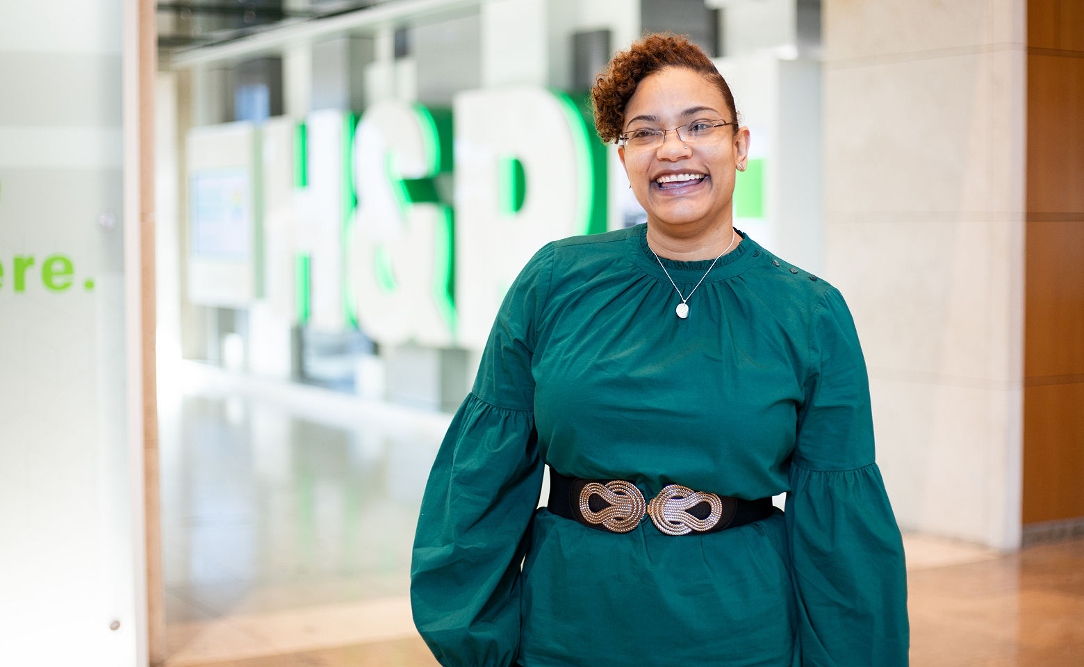 h&r block female employee smiling