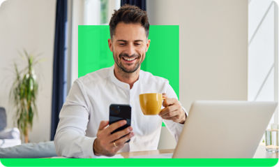 Happy H&R Block customer filing taxes on a phone