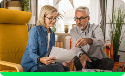 H&R Block couple looking over documents
