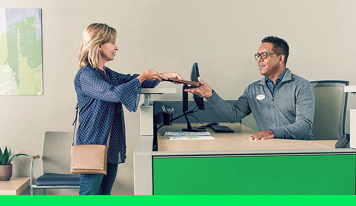 client dropping off documents at front desk