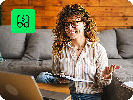 person using H&R Block Premium Online Tax Filing with unlimited expert tax help feature on laptop