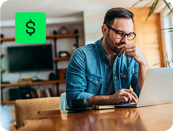 user reviewing income reporting details with H&R Block Self-Employed Online Tax Filing on a laptop