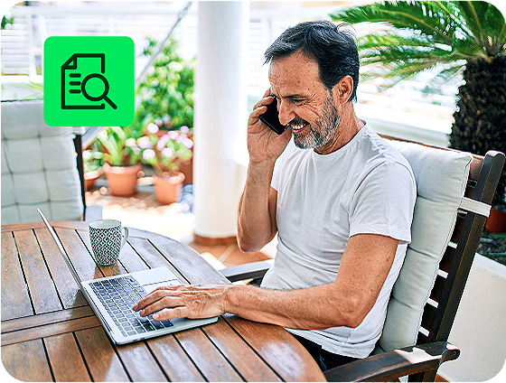 individual reviewing tax documents and filing taxes online with H&R Block free tax preparation on a laptop