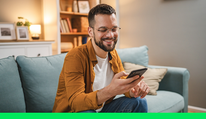 online client checking phone on couch