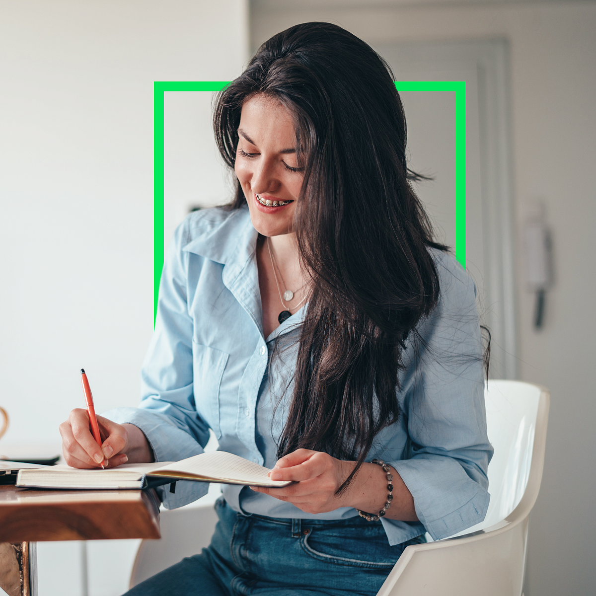 female client writing in notebook preparing for tax appointment