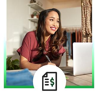 woman smiling doing her small business taxes