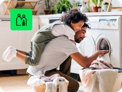 user multitasking with household chores and filing taxes online through H&R Block free tax preparation