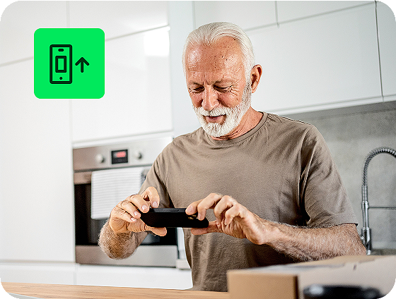 individual entering tax information on a smartphone using H&R Block Free Online tax filing service at home