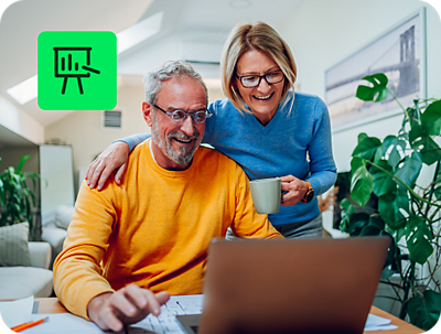 two people reviewing investment income reports with H&R Block Premium Online Tax Filing