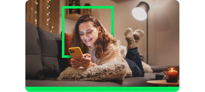 Happy H&R Block customer filing taxes on a phone 